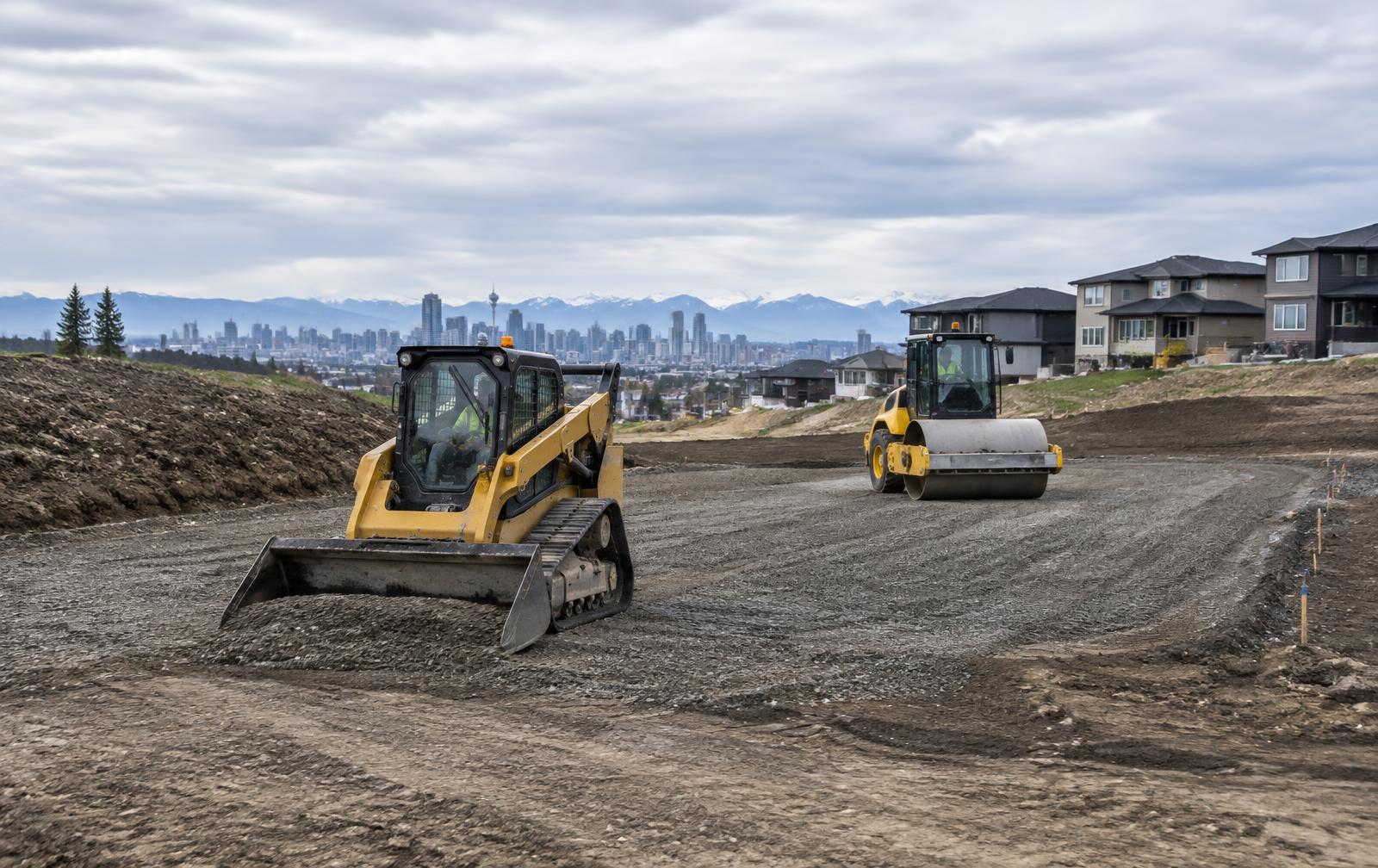 Construction grading equipment preparing a Calgary site